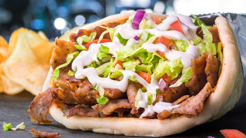 Gto Gyro · A Greek specialty blend of beef and lamb served traditionally on toasted pita bread with lettuce, tomato, red onion and tzatziki sauce. Served with fries.