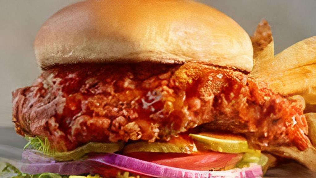 Buffalo Chicken Sandwich · Choose grilled or hand-breaded and fried chicken breast tossed in choice of Lube sauce, served atop shredded lettuce, tomato, onion and dill pickle chips on a brioche bun. Served with fries.