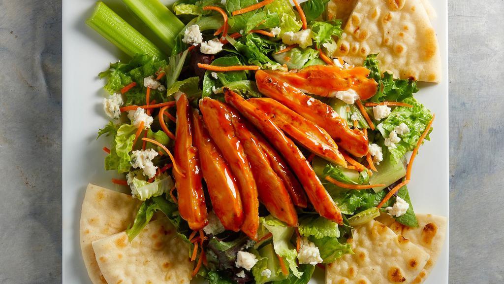 Buffalo Chicken Salad · Top Gear Tenders or grilled chicken breast tossed in choice of Lube sauce, served atop a bed of spring mix and chopped romaine lettuce, carrots, celery, bleu cheese crumbles and toasted pita wedges.