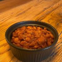 Baked Beans · Our house baked beans are made with bacon and ham hocks for extra flavor.
