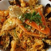 Arroz Marinero · Classic Coastal Ecuadorian Dish, w/ Yellow Rice, Vegetable, Crab Legs, Calamari, Mussels, Cl...