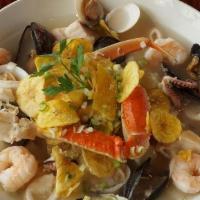 Plato De Mariscos · Coastal Seafood Platter. White Wine Mixed in Calamari, w/ Rice, Tilapia, Mussels, Crab Legs,...