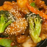 Sesame Chicken Bowl · Lightly breaded chicken tossed together with carrots and broccoli in a sweet ginger sauce to...