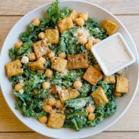 A Kale Of Two Cities · Shredded kale, parmesan cheese, chickpeas, diced tomatoes, cauliflower croutons, vegan caesa...