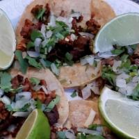 Tacos · Choice of al pastor, asada, or chicken.