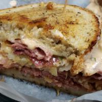 The Skinny John · Pastrami, corned beef, Swiss cheese, coleslaw and Russian dressing on grilled rye.