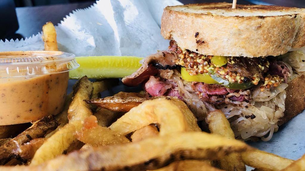 Pastrami Surprise · Grilled pastrami, provolone cheese, sauerkraut, spicy mustard, banana peppers and pickles and spicy mustard on grilled rye.