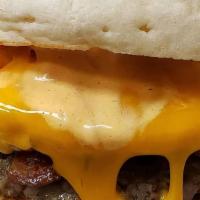 Breakfast Sandwich · Sausage, thick cut bacon, two eggs, and cheddar cheese on a huge English muffin.