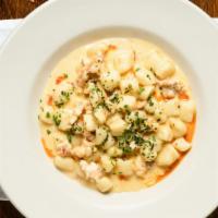 Lobster Gnocchi · poached lobster, lobster cream, chili oil