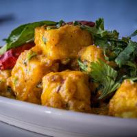Chilly Paneer · Baby corn pieces marinated in corn flour batter, spices, deep fried and tossed with spices a...