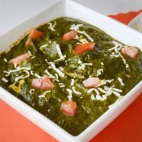 Saag Paneer · Indian cheese cooked with spinach, mild spices and herbs.
