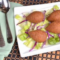 Fried Kibbeh · Fried pieces of ground meat mixed with cracked wheat and stuff ed with sautéed ground meat, ...