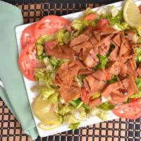 Fattoush · Lettuce, tomato, parsley, cucumber, and toasted pita bread mixed with our special homemade d...