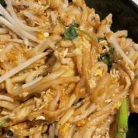 Combination Pad Thai · Flat rice noodles, bean sprouts, carrots, green onions, basil, peanuts. Comes with beef, chi...