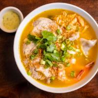 Banh Canh Cua · Comes with a thick crab soup, thick udon noodles, real crab meat, quail eggs, sliced pork, a...