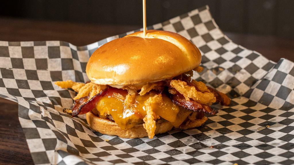 Hickory Cheddar Burger · Midwest Beef / Wisconsin Cheddar / Pecanwood Smoked Bacon / Fried Onion Straws / Classic BBQ Sauce