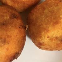 Papa Rellena · Mashed potato fritter with a ground beef center.