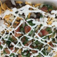 Asada Fries · French fries topped with steak, cheese, guacamole, pico de gallo and sour cream.