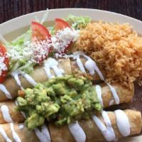 #4. Chicken Flautas  · Chicken taquitos. Served with rice and beans.