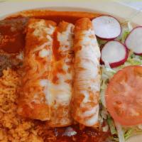 #7. Enchiladas Rojas · Beef enchiladas covered with red sauce and melted shredded cheese.