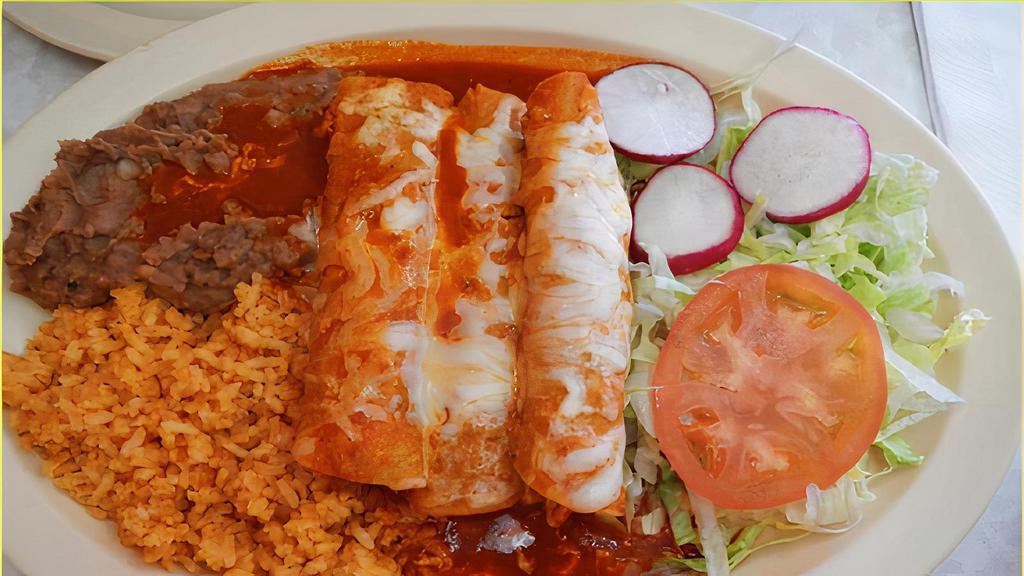#7. Enchiladas Rojas · Beef enchiladas covered with red sauce and melted shredded cheese.