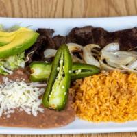 Carne Asada · 10oz prime shirt steak Carne Asada Meat grilled to perfection. 
Included: grilled onions, cr...