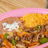 Bistec A La Mexicana · Steak simmered in tomato, fresh jalapenos, onions sauce choice of flour or corn tortillas