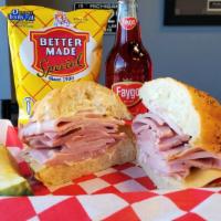 Baked Ham · Thick slices of house-baked Dearborn ham with Swiss cheese and mayonnaise on a kaiser roll.