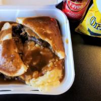 Hot Beef Brisket · Roast beef brisket open-faced style with mashed potatoes and gravy on white bread.
