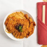 Katsu Don · Fried pork loin with egg and vegetable over rice.