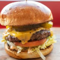 Shack'S Original Burger · Lettuce, tomatoes, pickles, American cheese, grilled onions and Shack Sauce on choice of bun.