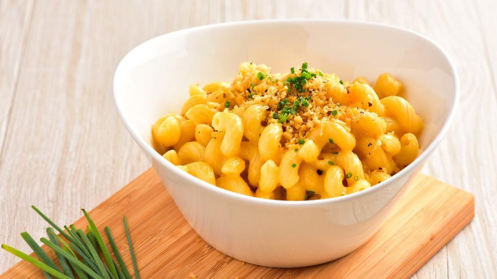 Mac N' Cheese · Our famous mac n' cheese made with our house cheese sauce.