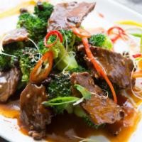 Orange Beef · Fresh hot beef drizzling with tangy orange sauce served with white rice.