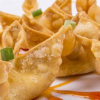 Fried Crab Rangoon · Crispy wonton wrappers filled with cream cheese and juicy crab meat.