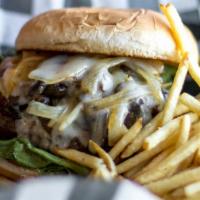 Louies Shroom & Swiss Burger · Mayo, lettuce, tomato, pickles, sauteed mushrooms, grilled onions, and Swiss cheese. Served ...
