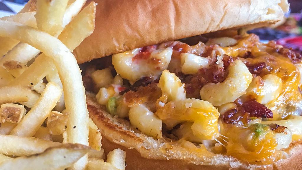 The Joker Burger · Spicy mac and cheese, bacon, and cheddar Jack cheese. Served with half a pound of golden fries.