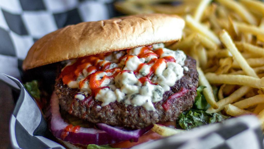 Sriracha Bleu Cheese Burger · House Sriracha sauce, bleu cheese crumbles, lettuce, tomato, red onion, pickles. Served with a half pound of golden fries.