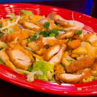 Chicken Tender Salad · Chicken tenders, mixed greens, croutons, cheddar Jack cheese, chives, and choice of dressing.