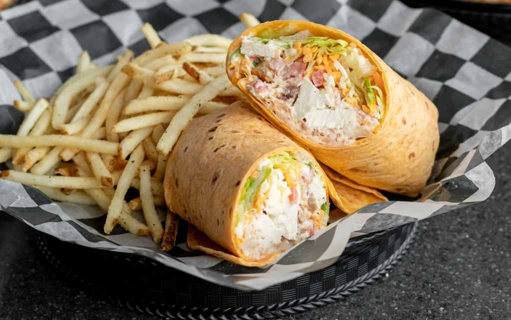 Turkey Chicken Club Wrap · Grilled chicken, shaved turkey, bacon, cheddar Jack cheese, tomatoes, mixed greens, ranch dressing. Served with 1/2 lb. golden fries.
