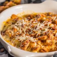 Mac And Cheese · Spicy mac and cheese baked with chicken, bacon, cheddar Jack cheese, Parmesan cheese, and ga...