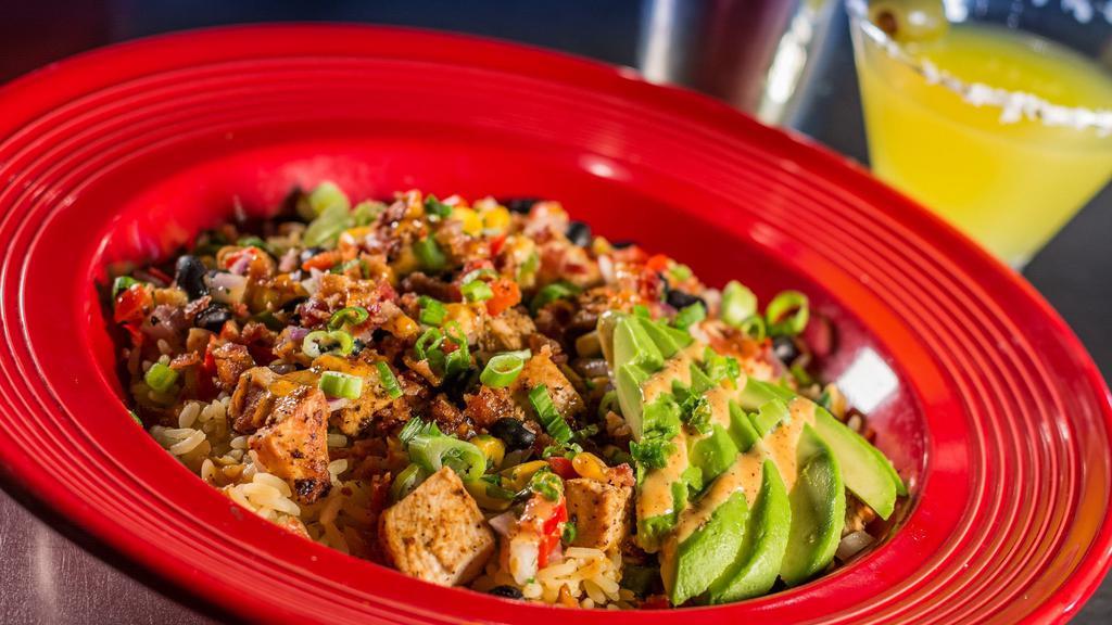 Southwest Rice Bowl · Shredded chicken, black bean salsa, bacon, avocado, chives, and house dressing.
