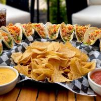 Tacos Togo · A dozen chicken tacos served with chips, queso & salsa