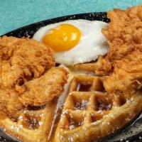 Tally'S Chicken & Waffles · Two hand-battered chicken tenders served atop a Belgian waffle dusted with powdered sugar wi...