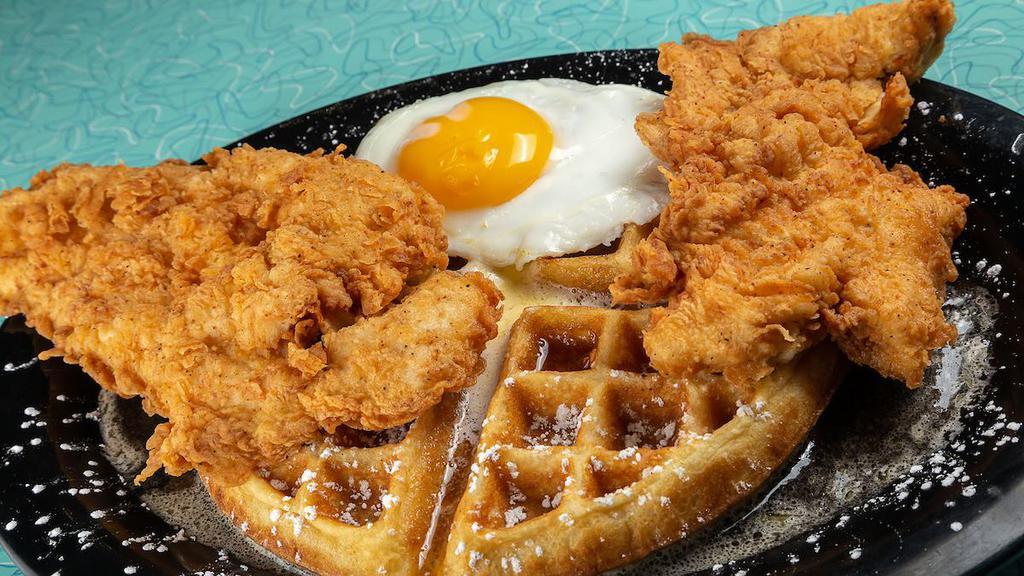 Tally'S Chicken & Waffles · Two hand-battered chicken tenders served atop a Belgian waffle dusted with powdered sugar with two eggs any style.