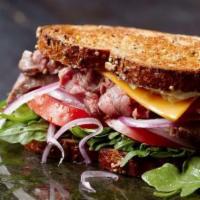 Renoir'S Etched Roast Beef · Roast Beef | Cheddar Cheese | Lettuce | Tomato | Red Onion | Creamy Horseradish |  Grilled M...