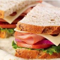Stacked Ham & Swiss · Ham | Swiss Cheese | Lettuce | Tomato | Stone Ground Mustard | Sourdough Bread