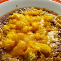 Starliner Chunky Chili · Home made beef chili, topped with our own Jalapeño cornbread, cheddar cheese, and green onio...