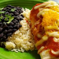 Big Chicken Burrito · Served with black beans and rice.