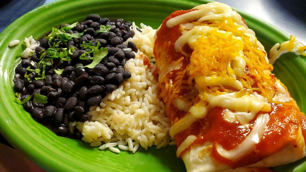 Big Chicken Burrito · Served with black beans and rice.