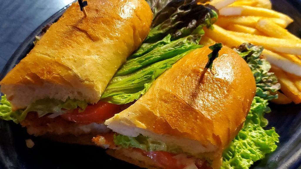 Po' Boy · Fresh fish filet with green onion mayo, lettuce, tomato, red onion, served with French fries.